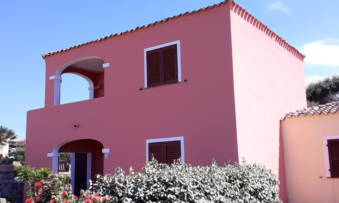 Aglientu Apartment | Pink house in residence with pool, wifi -air conditioner, near the sea
