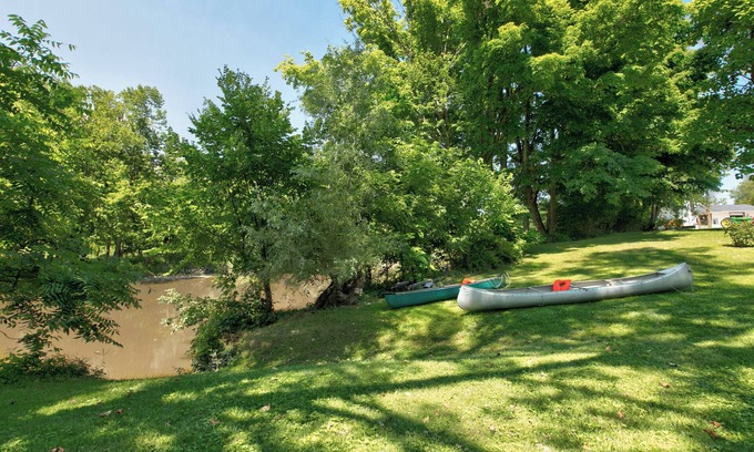 Croswell House | Private access Riverbend Retreat, fishing, canoes, wildlife, & swinging bridge
