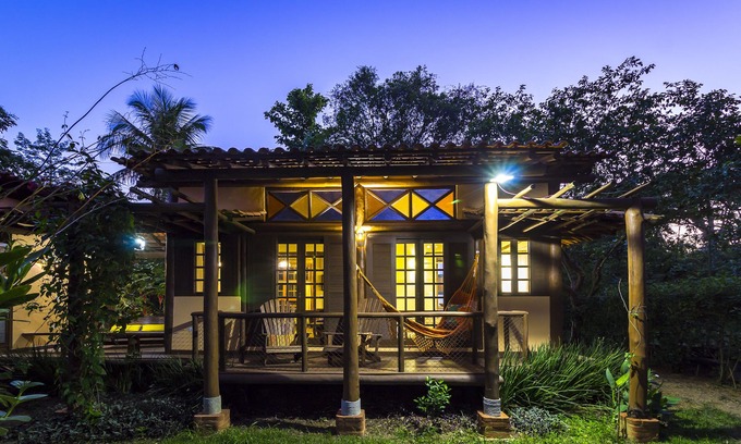 Paraty Apartment | Property with a small boat pier that makes island tours.
