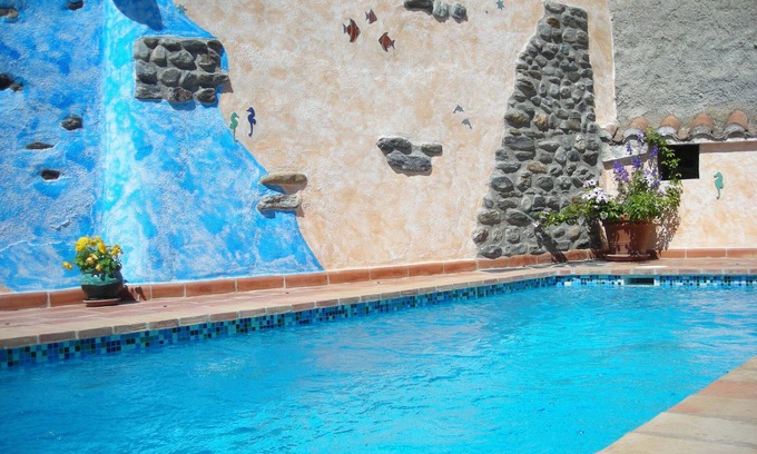 Orgiva House | Quiet and comfortable villagehouse,private garden with heatable pool,garage.