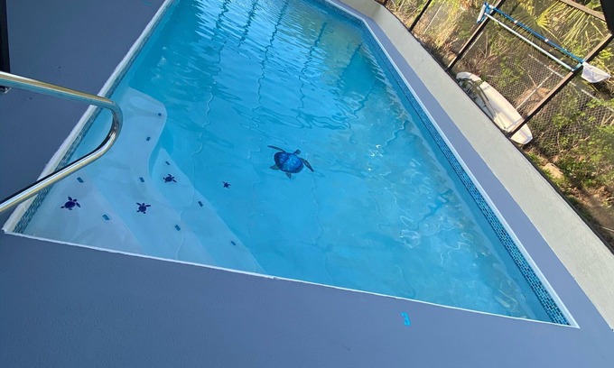 Hudson House | Quiet Gulf Canal Neighborhood with Enclosed Lanai & Heated Pool EV friendly