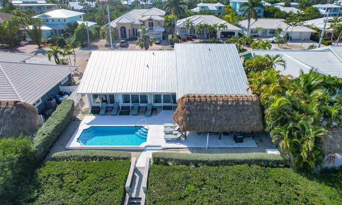 Coury House | Reel 'Em In: Your Beautiful KCB Retreat, Private Pool, Dock, Tiki Hut, Cabana Club & Dog-Friendly!
