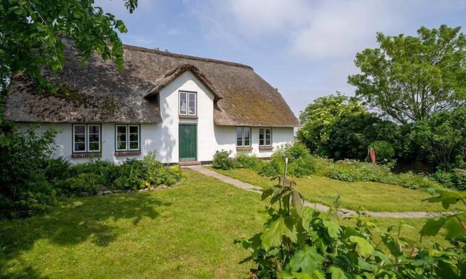 Westerhever Villa | Reetgedecktes Ferienhaus in Westerhever mit Sauna