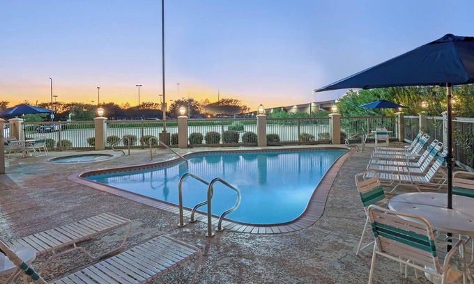 Westchase Hotel | Refined Room for Professionals with Poolside Zen | Free Parking