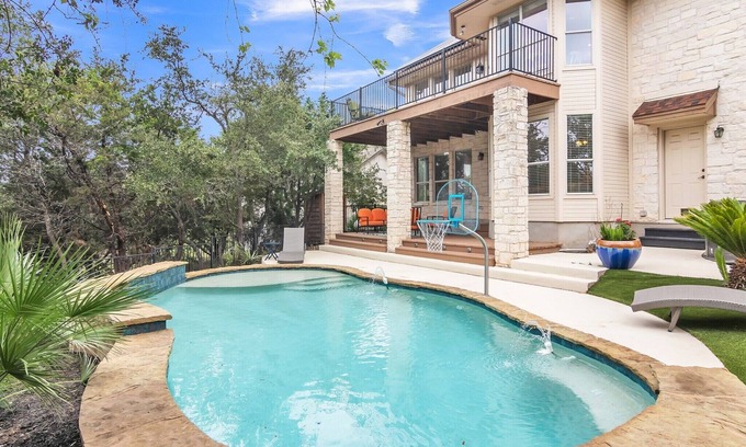 Travis Landing House | Relax at the pool after touring Austin! Marinas close by to enjoy Lake Travis!