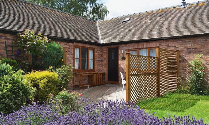 Munslow Cottage | Relax in front of the woodburner in this single-storey barn conversion.