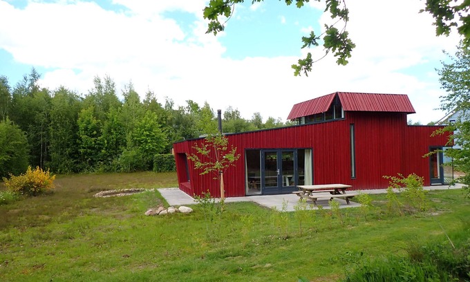 Gasselte House | Relax on the lovely lounge sofas with panoramic views of the nature garden? Or a week of quiet (tele)work, while walking straight into the woods for a lunch walk during your break?