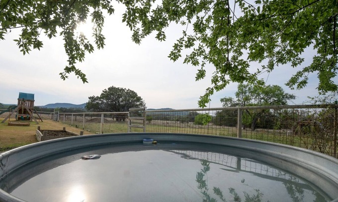 Utopia House | Relax with Hill Country Views! Stock tank POOL and great backyard!