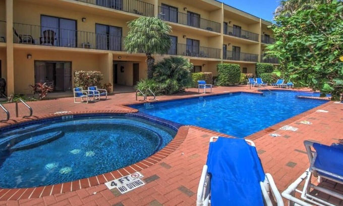 South Padre Island Condo | Relaxing Retreat with Pool & Hot Tub, Partial Ocean View - Steps from Beach