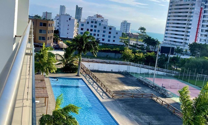 Tonsupa Apartment | Resort Playa Azul Tonsupa Apartment with a view of 2 rooms.