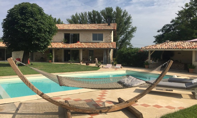 Layrac Villa | Restored former sheepfold with dovecote, swimming pool and lake view.