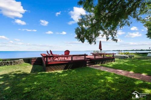 Luna Pier House | Restored historic log cabin & deck on Lake Erie