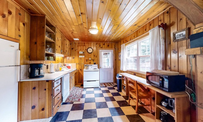 Wallowa County House | Riverfront cabin with large yard, great deck, fireplace, washer/dryer, & WiFi