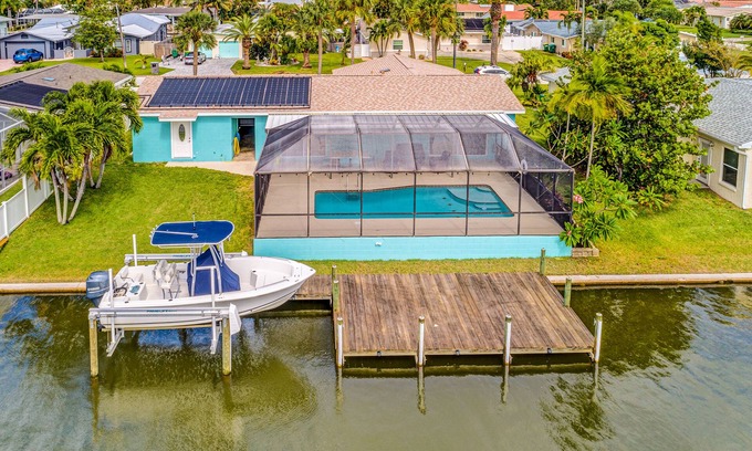 Venetian Way House | Riverfront home with private heated pool, dock, AC & W/D - dog-friendly