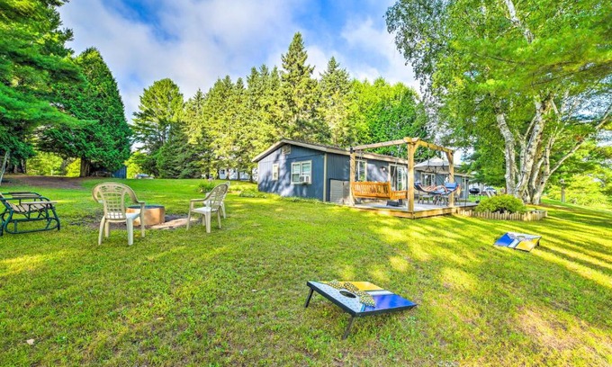 Cheboygan House | Riverfront Home with Dock about 6 Mi to Cheboygan!