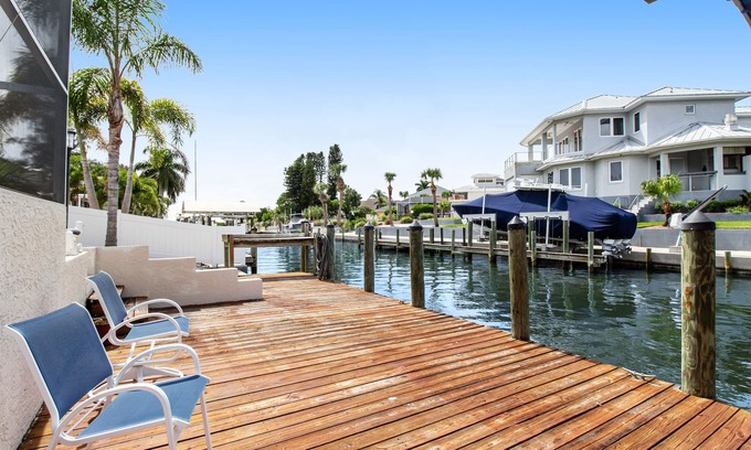 Bayshore Gardens House | Riverfront home with screened private pool, outdoor kitchen, & water access