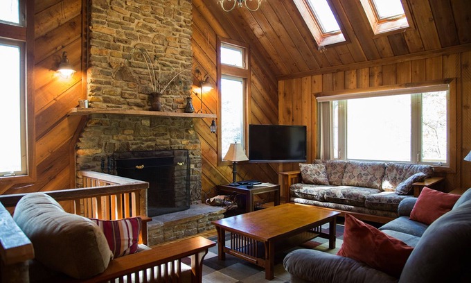 Elkins House | Riverfront luxury in the woods - main level master bedroom