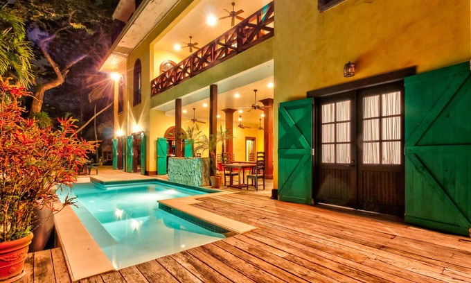 Bullet Tree Falls House | Riverfront Retreat with Balcony, WiFi, Partial AC, Shared Pool