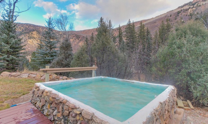 Carbondale House | Riverside cabin with natural spring hot tubs - close to skiing & fishing