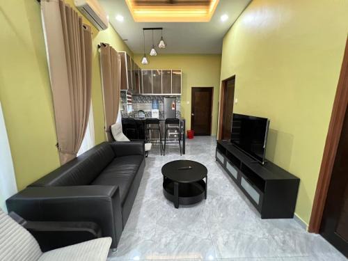 Taman Delima Ski Chalet | Robi Homestay