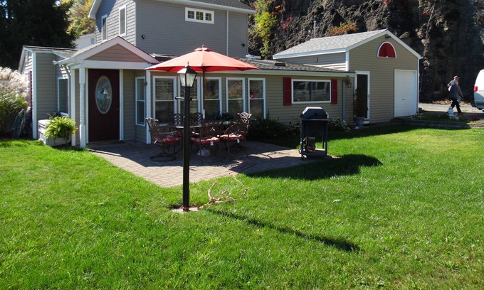 Valois Cottage | Romantic home on level Seneca Lake Front.