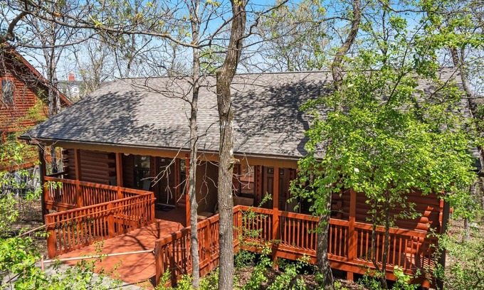 Branson Theater District Cabin | Romantic Studio Cabin with Fireplace & Wooded Deck