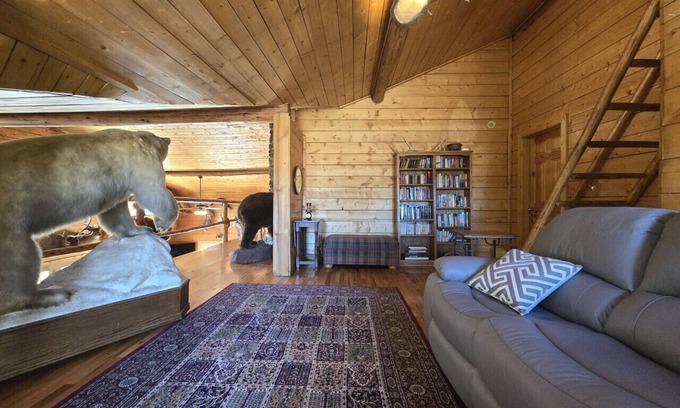 Buckinghorse River Cabin | Room 5 at the Main Lodge with a queen bed and single bed.
