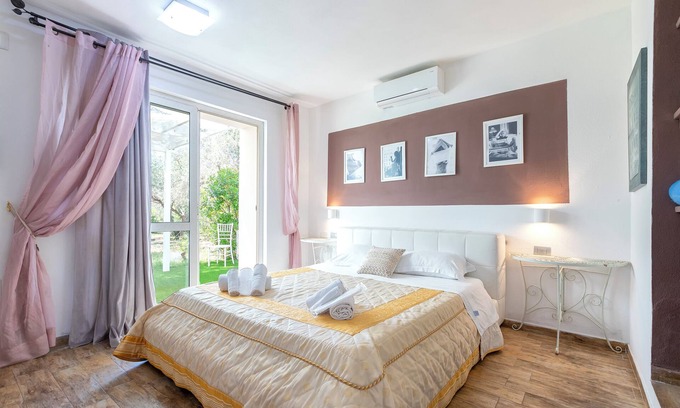 Sorso Apartment | Room 'Double Corbezzolo Con Patio' with Shared Pool, Private Terrace and Air Conditioning