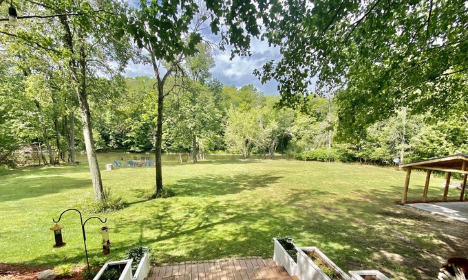 Paris House | Rustic large luxury home with 300 feet of riverfront surrounded by woods.