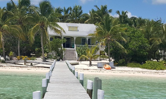 Lubbers Quarters Cay House | Sandy beachfront paradise with dock and a/c bedrooms at Green Bananas Cottage