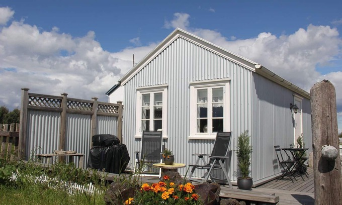 Eyrarbakki Cottage | Seaside cottages is a detached, 19th century stone-built cottage which stands by the Atlantic ocean