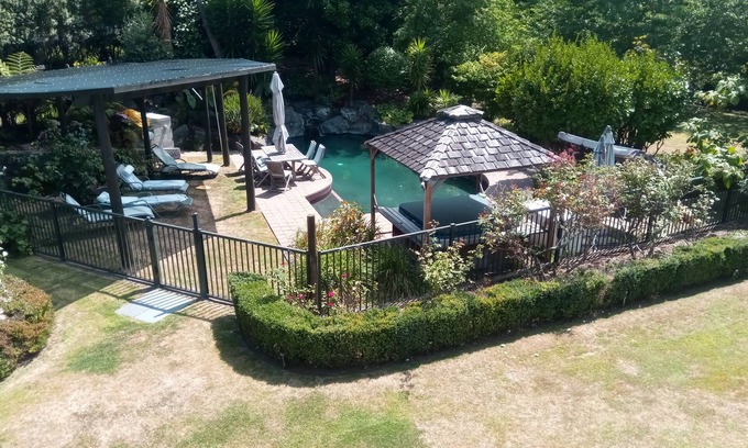 Tauriko House | Serenity @ Large Bedroom with Full Shared Bathroom with double bath.