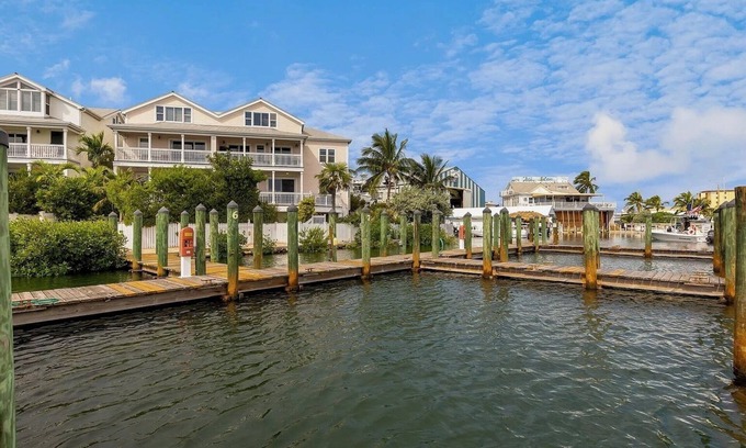 Meadows House | SEVENTH HEAVEN~Waterfront 5 BR, 4 Ba Townhome with Pool, Elevator & Dockage!