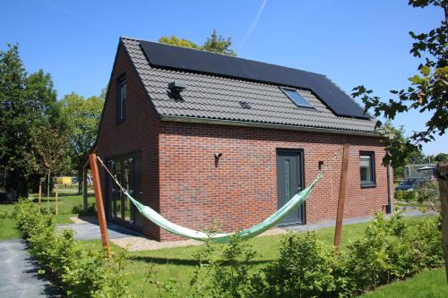 Sint Maarten House | Slapen tussen de duinen by Droomvilla