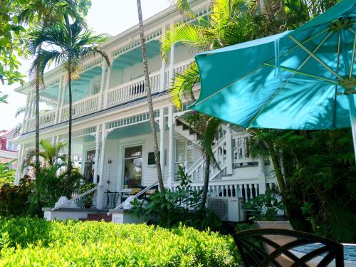 Uptown - Upper Duval Bed & Breakfast | Southernmost Point Guest House & Garden Bar