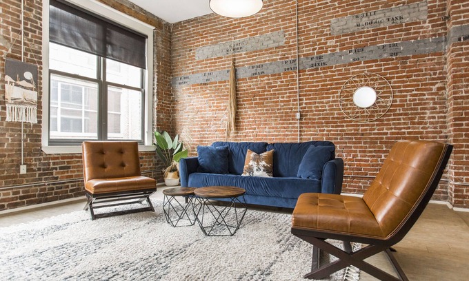 River Market Apartment | Spacious 2-bed loft with full kitchen, washer/dryer, city views, and in-building gym, game room, and coffee bar. Walkable location with streetcar access just steps away.