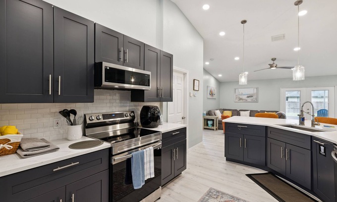 Palm Bay House | Spacious 4 bedroom, 2000 sq ft home with parking on premise.