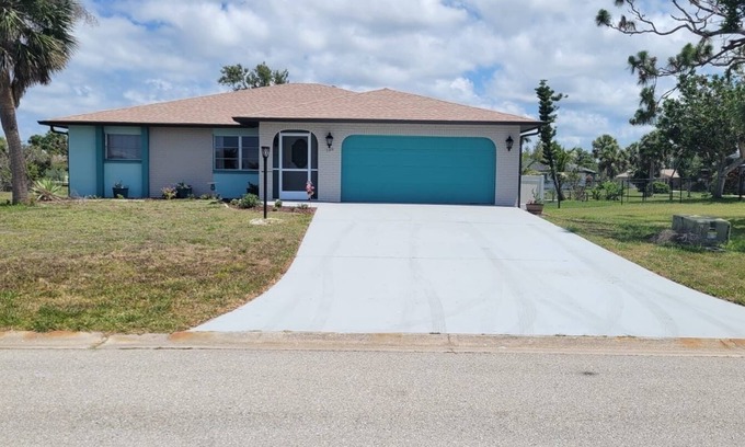 Oakland Hills House | Spacious 4-bedroom house in charming Rotonda West with WiFi, AC, canal front.
