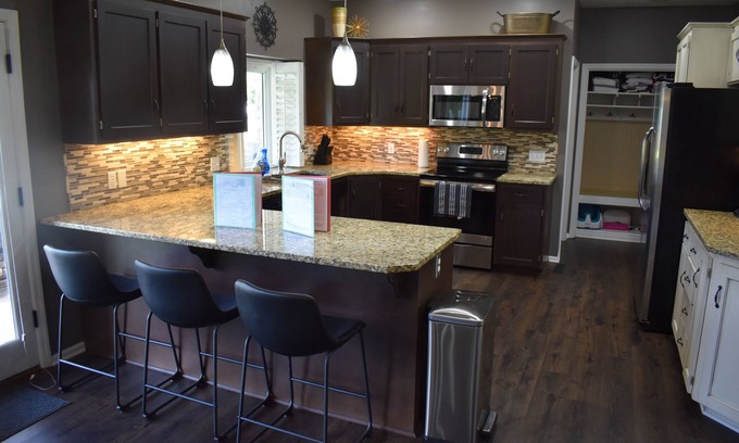 Omaha House | Spacious 5-bed 4-bath retreat. Backyard oasis with pool, hot tub, and fireplace.