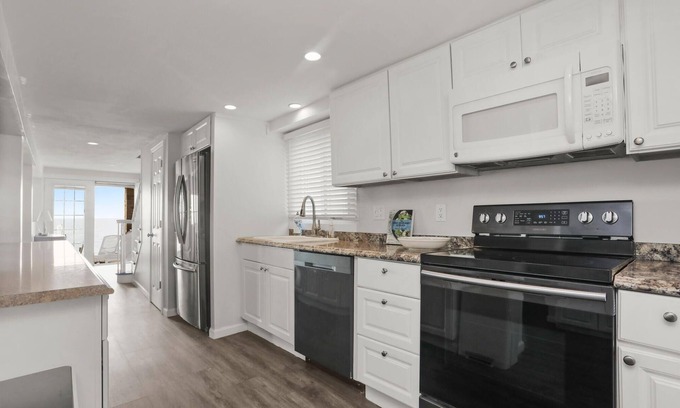 Devon House | Spacious Beachfront home in vibrant Beach Community!