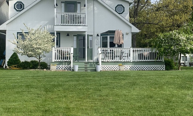 Port Austin House | Spacious beachfront Cape Cod lakehouse in Port Austin/Caseville Sleeps 12