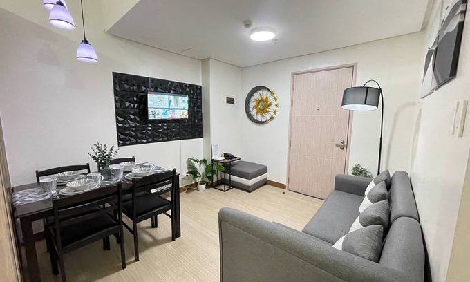 Novaliches Condo | Spacious Comfort: Two bedrooms & large living space ideal for families friends