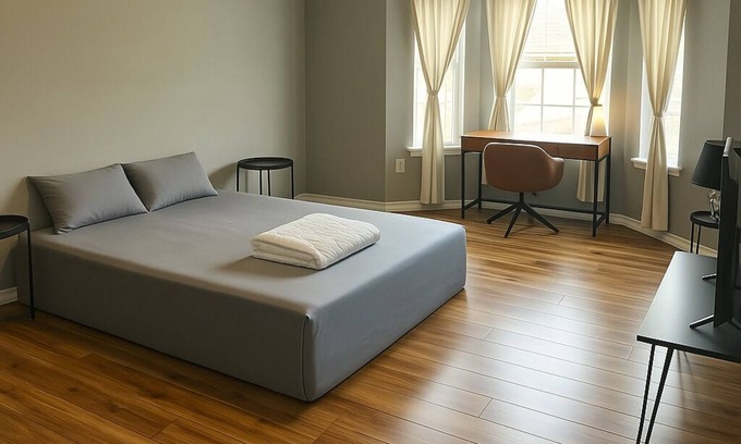 Braithwaite House | Spacious comfortable King room. Work-friendly. High-speed internet w/50" TVs