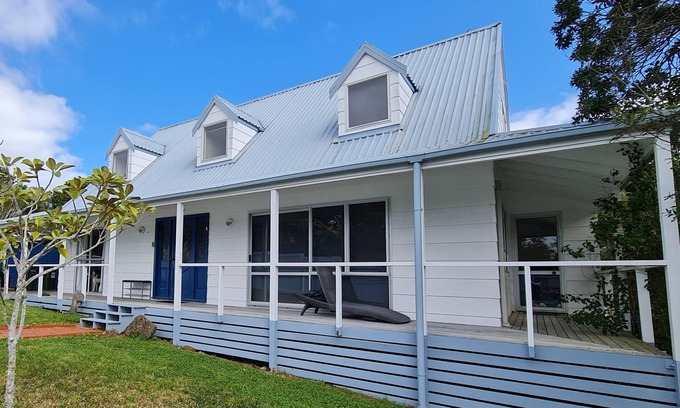 Orewa House | Spacious Family Home with deck & garden. Short walk to the beach.