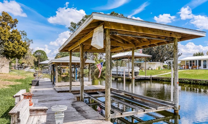Highland House | Spacious home with water view, dock, lovely patio, central AC & washer/dryer