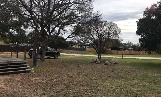Tow House | Spacious open floor plan with beautiful oak trees.