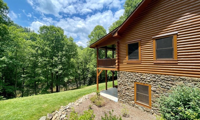 Lansing Cabin | Spacious Riverfront Log Cabin w/Hot Tub, Pet Friendly, Pool Table, Firepit