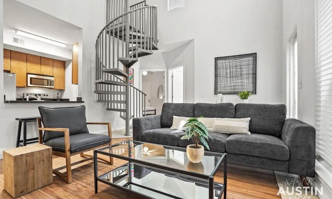 West Campus Apartment | Spiral Stairs to Loft Bedroom Balcony with Shade