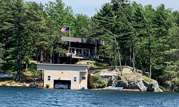 Hammond House | St. Lawrence River Cottage with 107 ft of river frontage and a boathouse