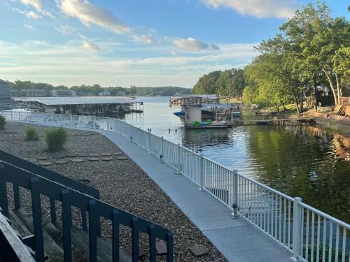 Osage Beach Apartment | STAIRS OPTIONAL! Lakefront! Pool! On Water! Convenient Fishing!